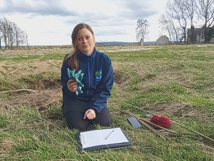 Karen Muller with survey equipment